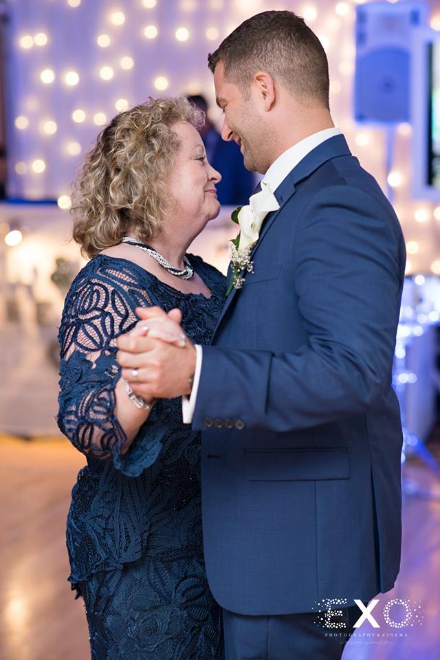 groom and his mother dancing