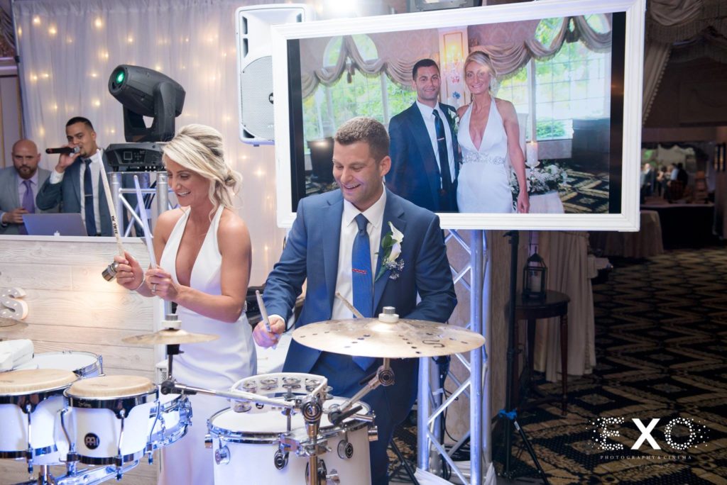 bride and groom playing the drums at Giorgio