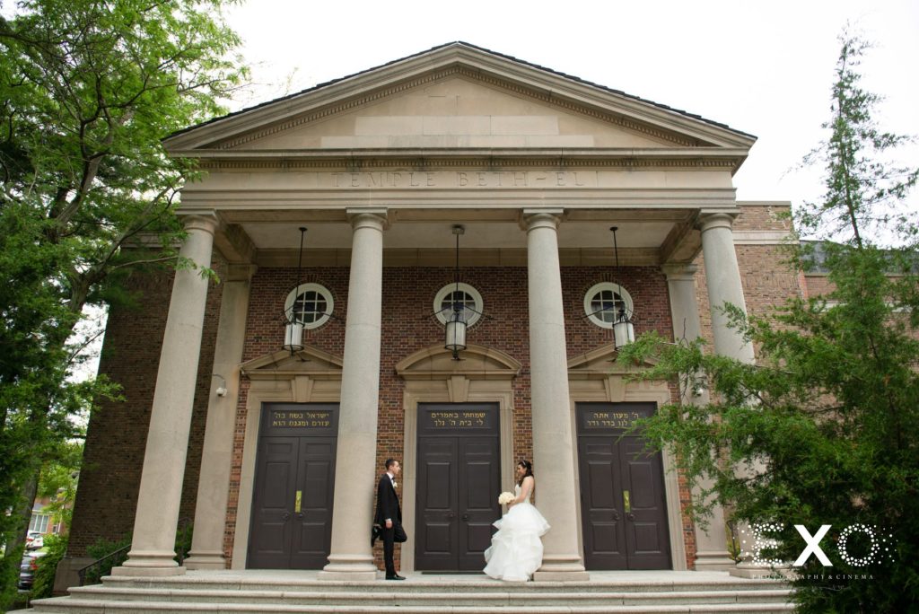bride and groom outside Temple Beth El Cedarhurst