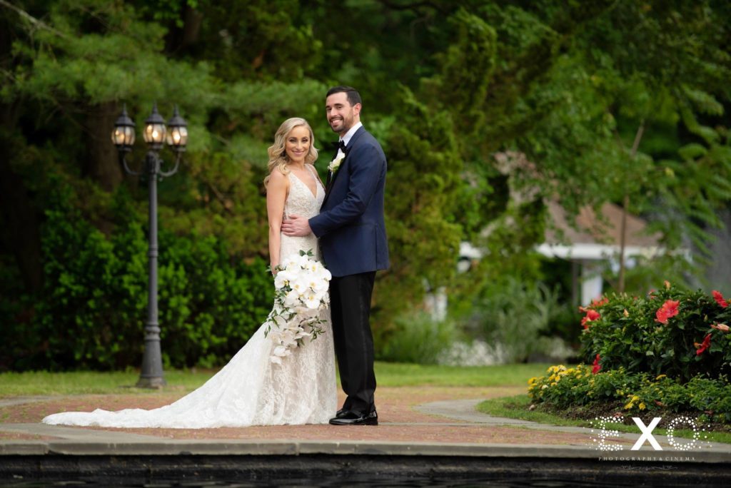 bride and groom posing outside at Woodbury Country Club