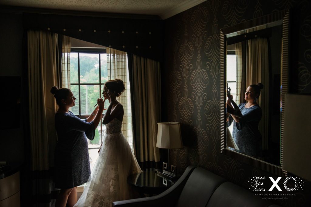 bride getting her makeup done at Fox Hollow