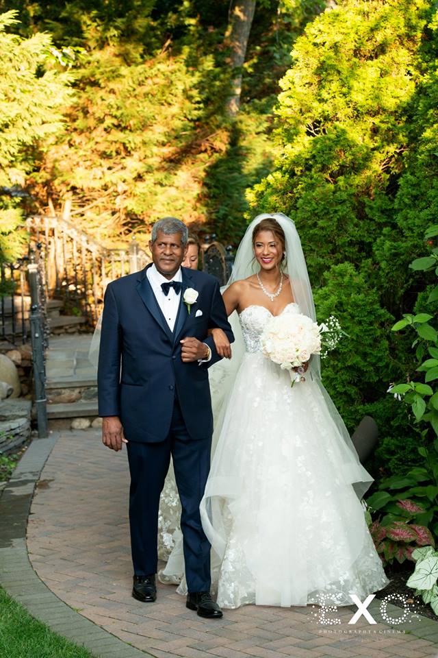 bride and father walking down the aisle at Fox Hollow