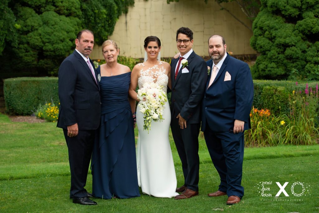 bride and groom with family at The Mansion at Oyster Bay