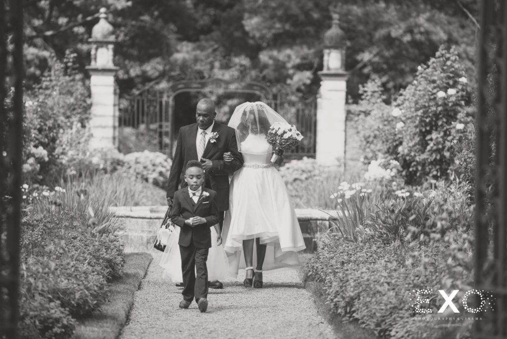 bride and her father walking down the aisle at Old Westbury Gardens