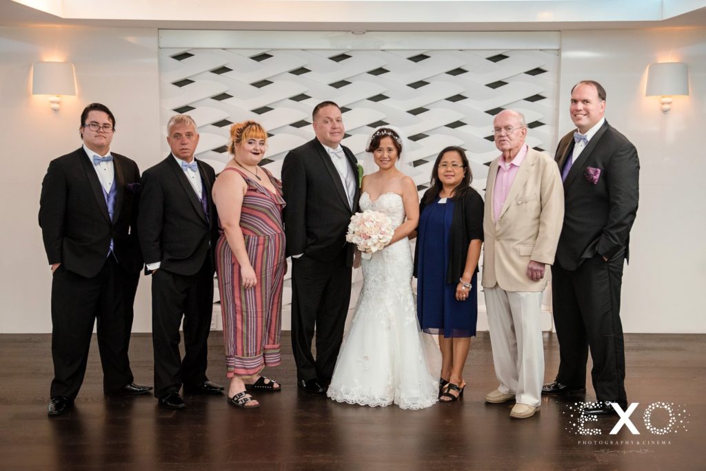 bride and groom with family at Harbor Club at Prime