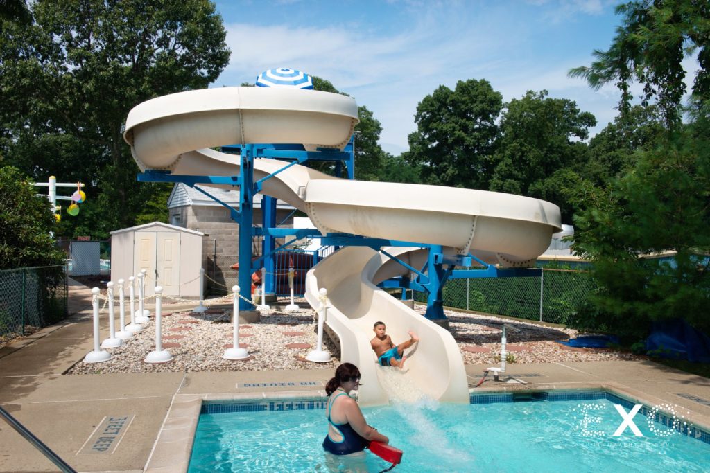 child on water slide at Crestwood Country Day Camp