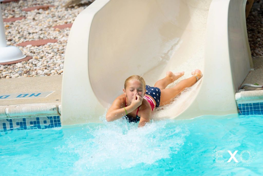 guest going down the water slide at Crestwood Country Day Camp