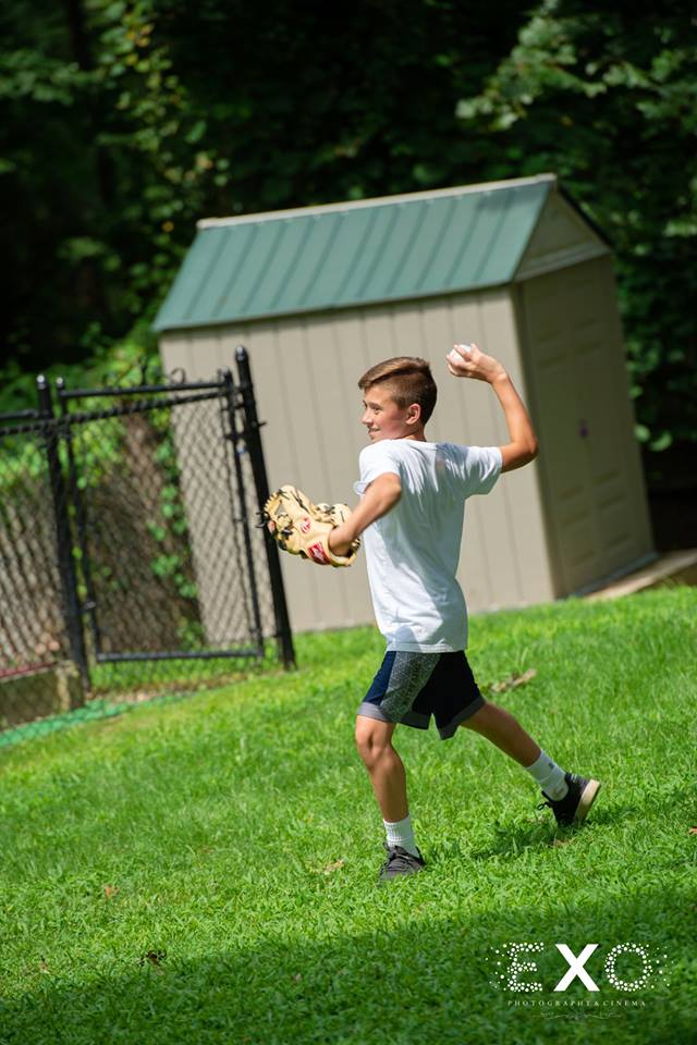 guest playing baseball at Crestwood Country Day Camp