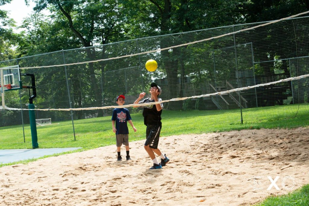 guests playing volleyball at Crestwood Country Day Camp