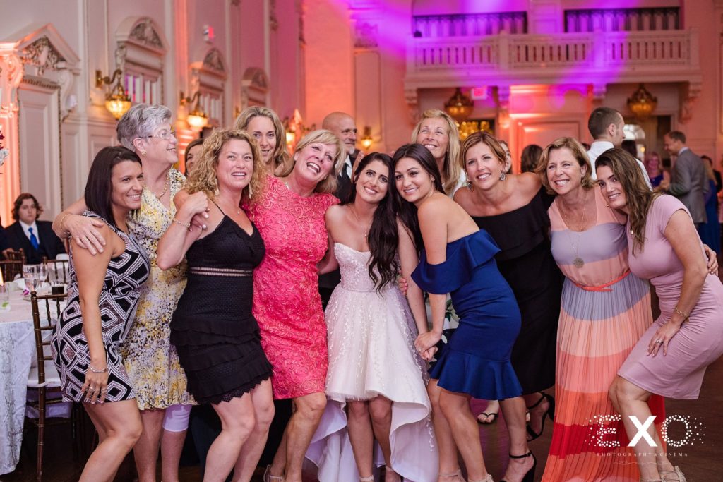 bride with guests at Bourne Mansion