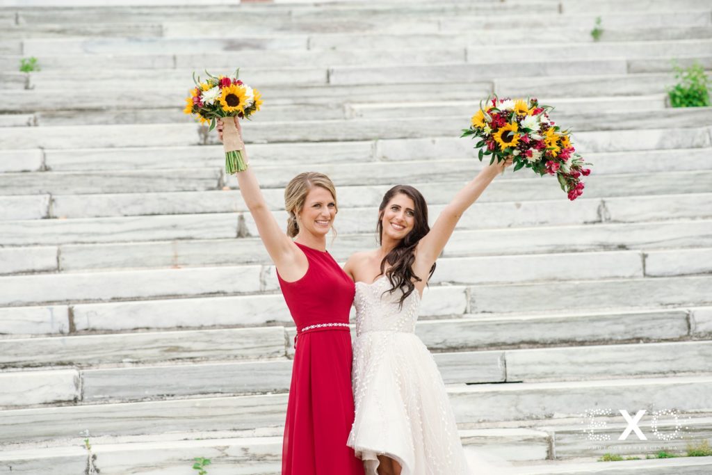 bride and her sister posing