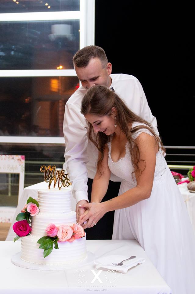 bride and groom cutting cake at Sunny Atlantic Beach Club