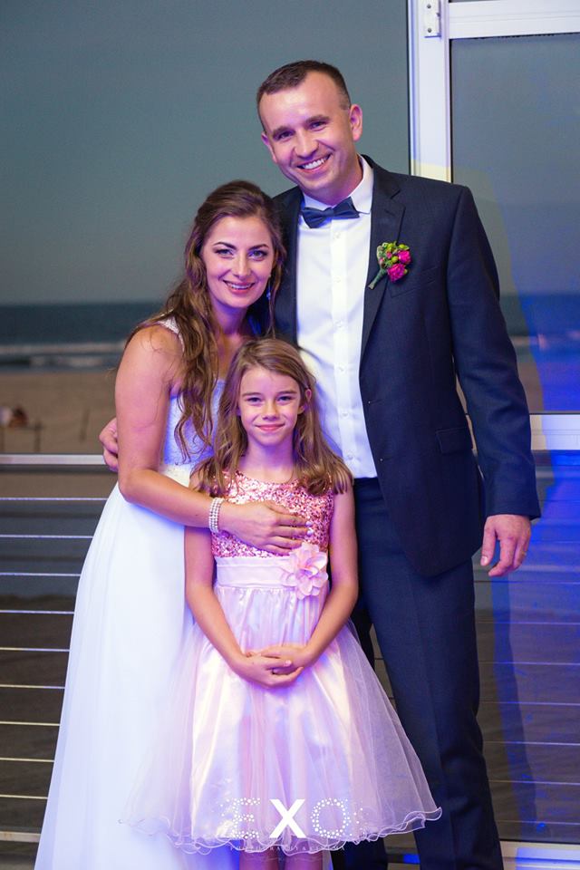 bride and groom with kid at Sunny Atlantic Beach Club