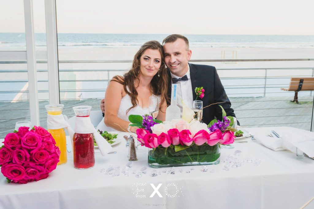bride and groom at sweetheart table at Sunny Atlantic Beach Club