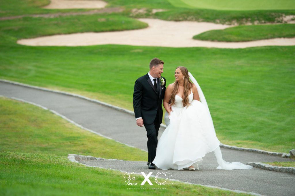 bride and groom walking the grounds at Stonebridge Country Club