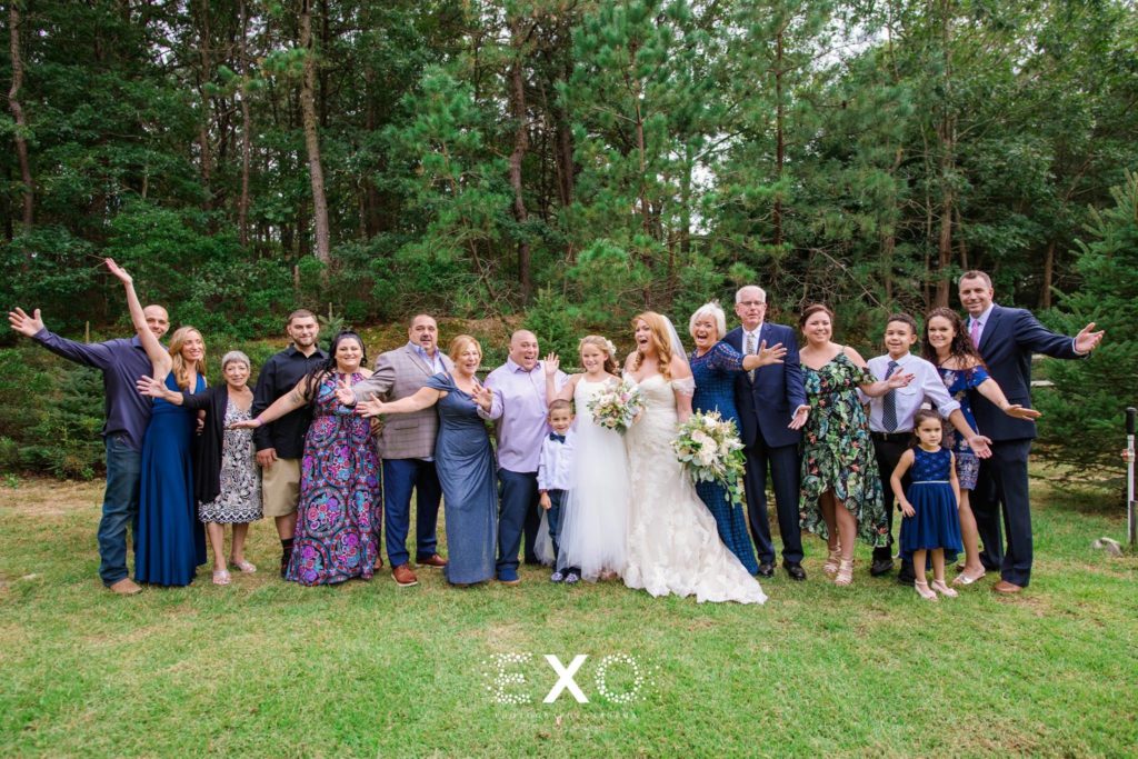 bride and groom with all their family