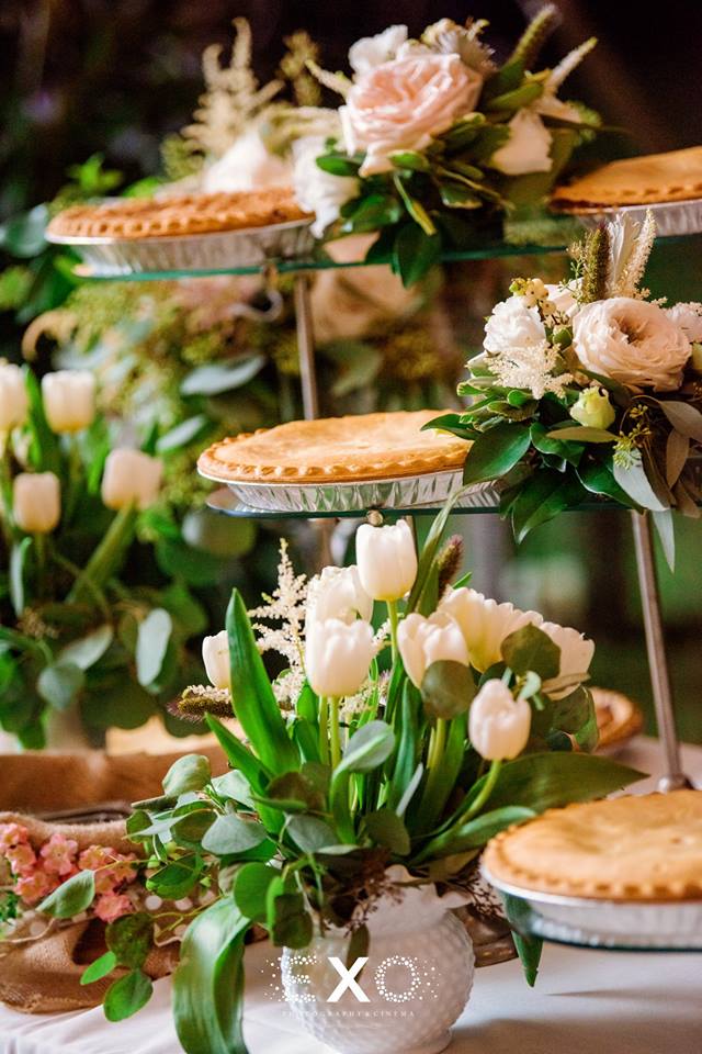 delicious desserts with floral arrangements at their private residence