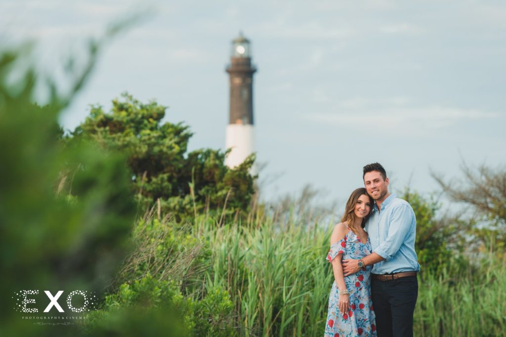 couple standing in front of the Fire Island Lighthouse