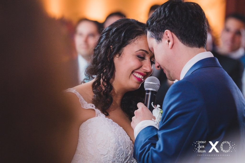 bride and groom with microphone at Mansion at Oyster Bay