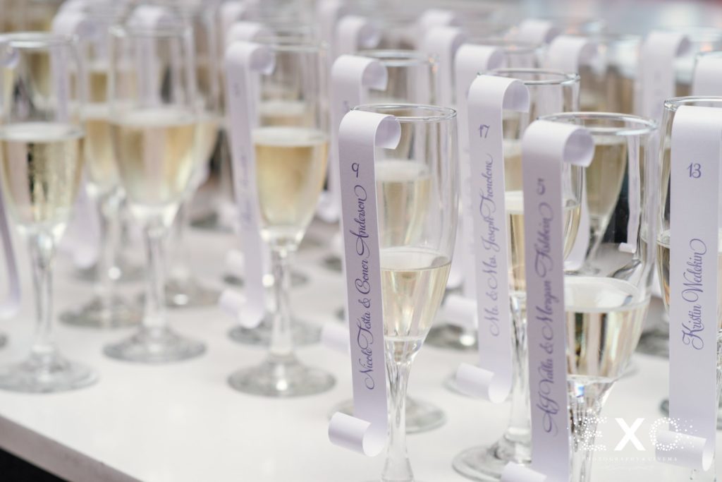 champagne flutes and scroll signs