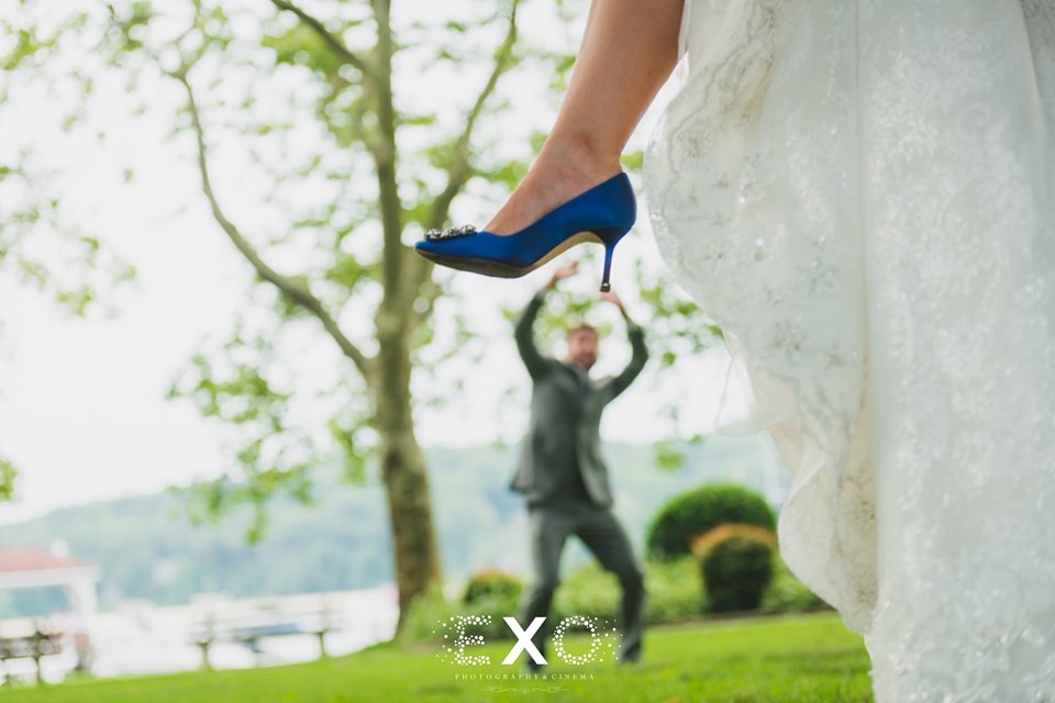 bride's shoe with groom in the back at Larkfield