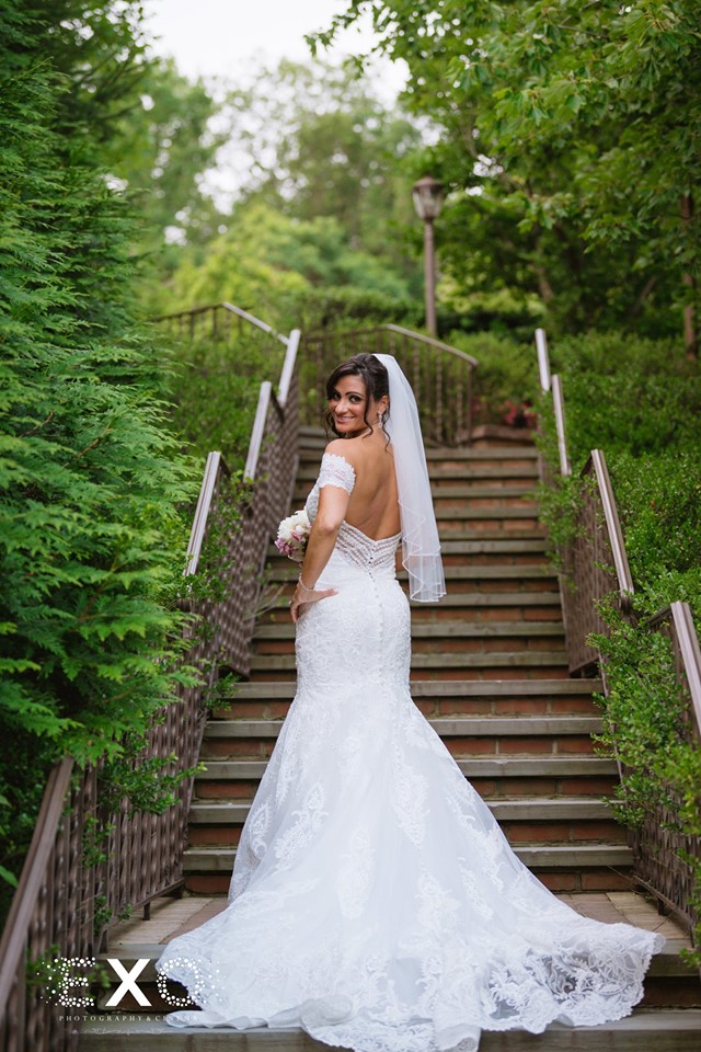 bride standing by the stairs
