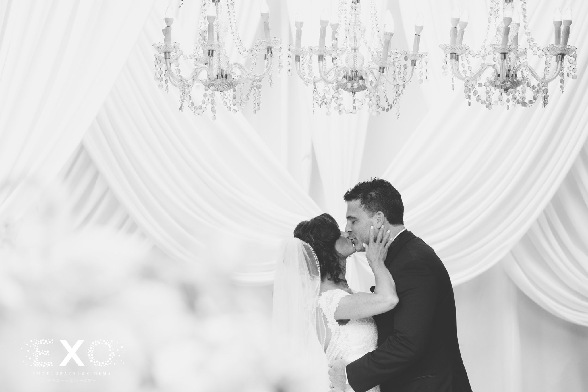 bride and groom kissing at ceremony at Crest Hollow Country Club