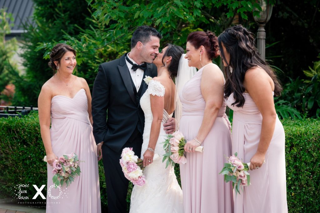 bride and groom with bridesmaids