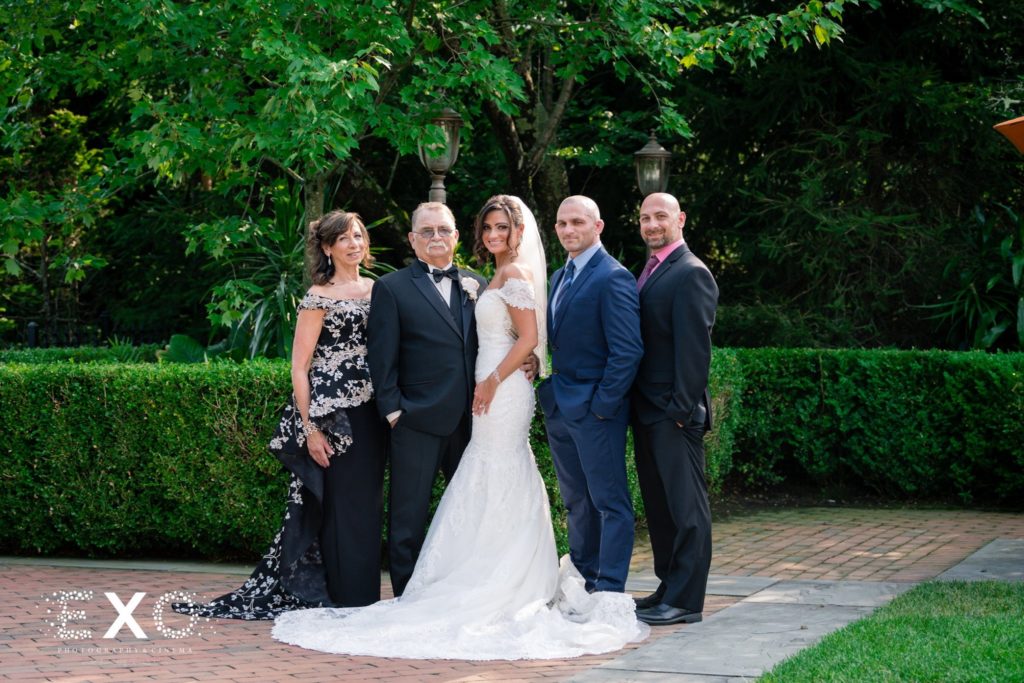 bride with her family outside Crest Hollow Country Club