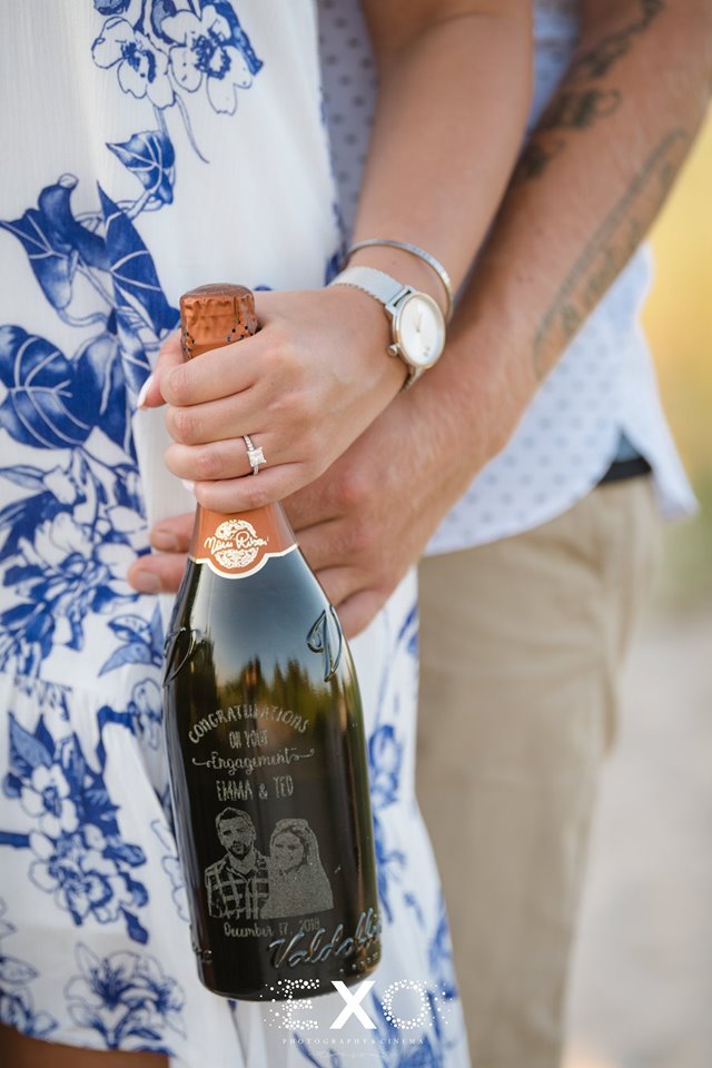 couple with customized champagne bottle