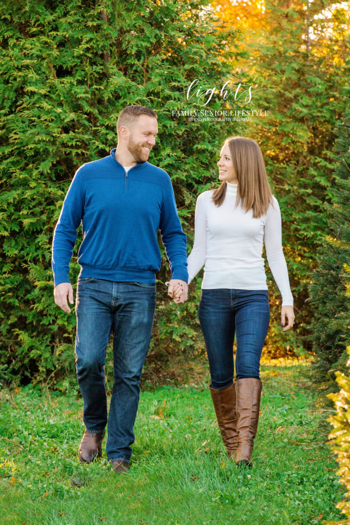 Couple Holding hands at Tree Farm