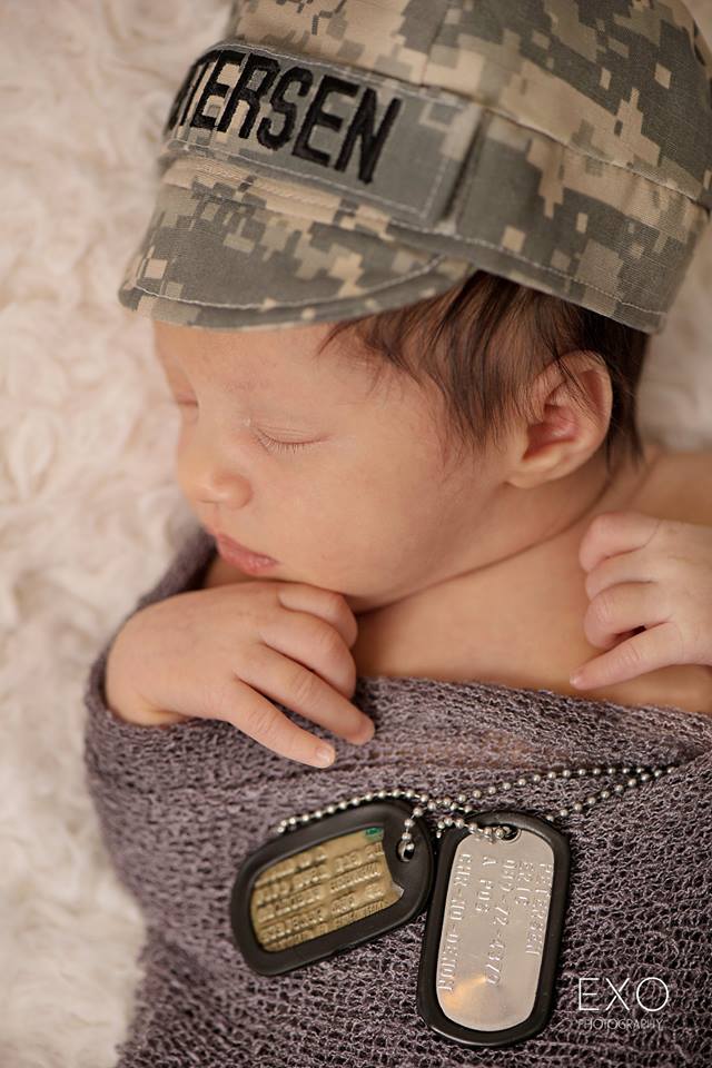 baby with army hat and dog tags