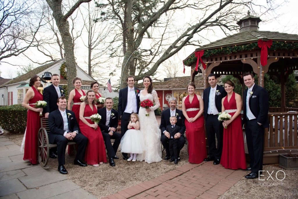 bride and groom with bridal party outside The Milleridge Cottage