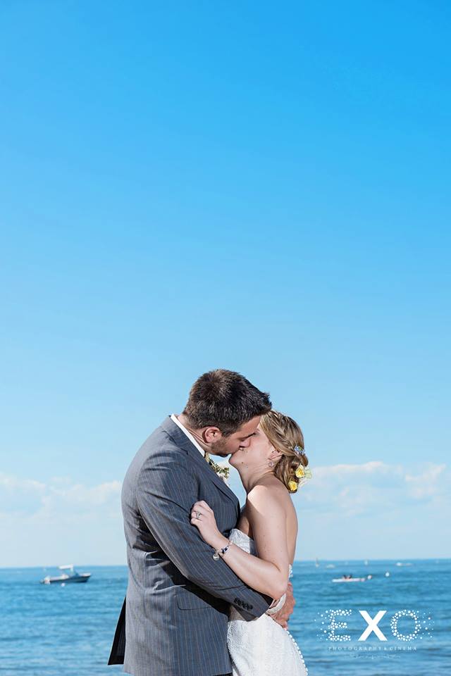 bride and groom kissing on the beach at The Head of the Bay Club