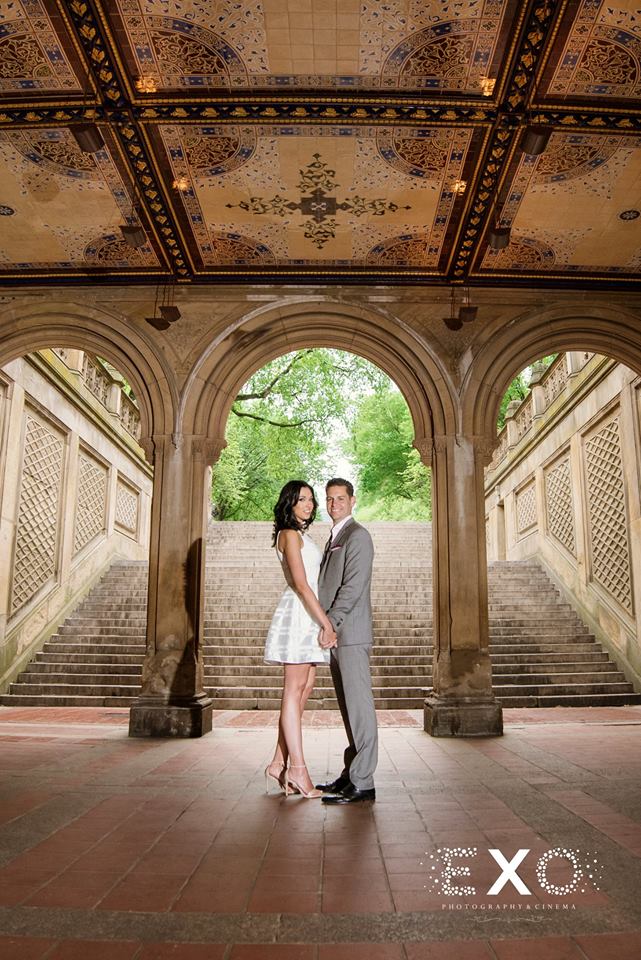 couple smiling in building in Central Park