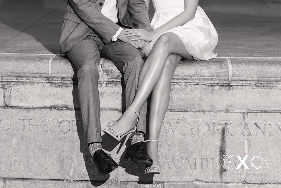 couple sitting on concrete