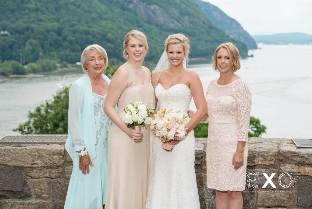 bride and family smiling outside The Thayer Hotel