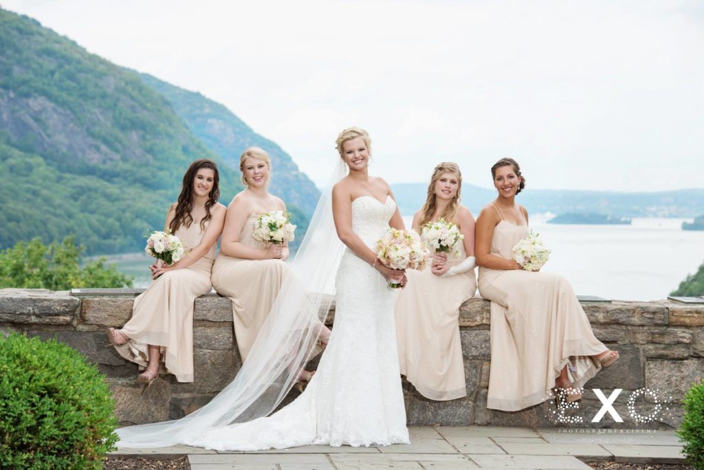 bride and her bridesmaids posing outside The Thayer Hotel