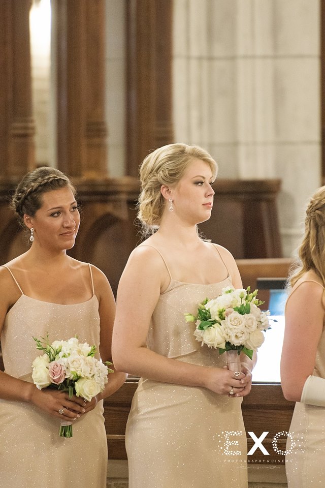 bridesmaids watching during the ceremony