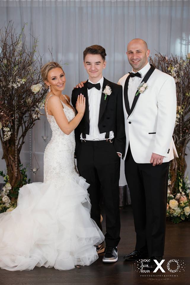bride and groom with bride's son at Harbor Club at Prime
