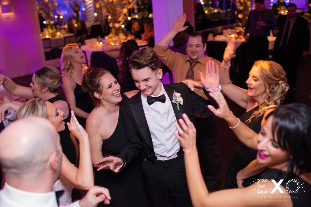 bridesmaids and groomsmen dancing at Harbor Club at Prime