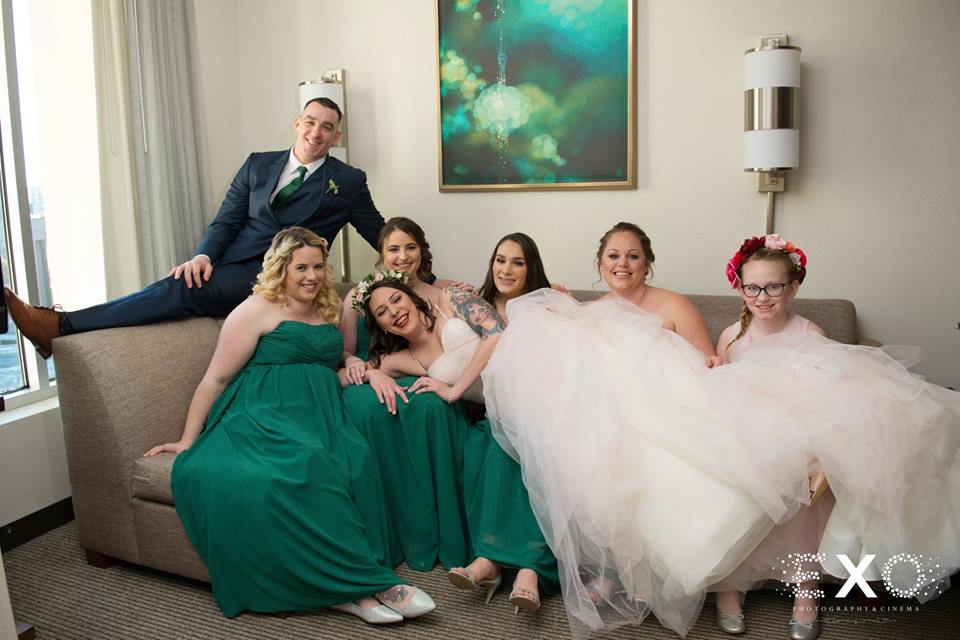 bride laying on her bridesmaids