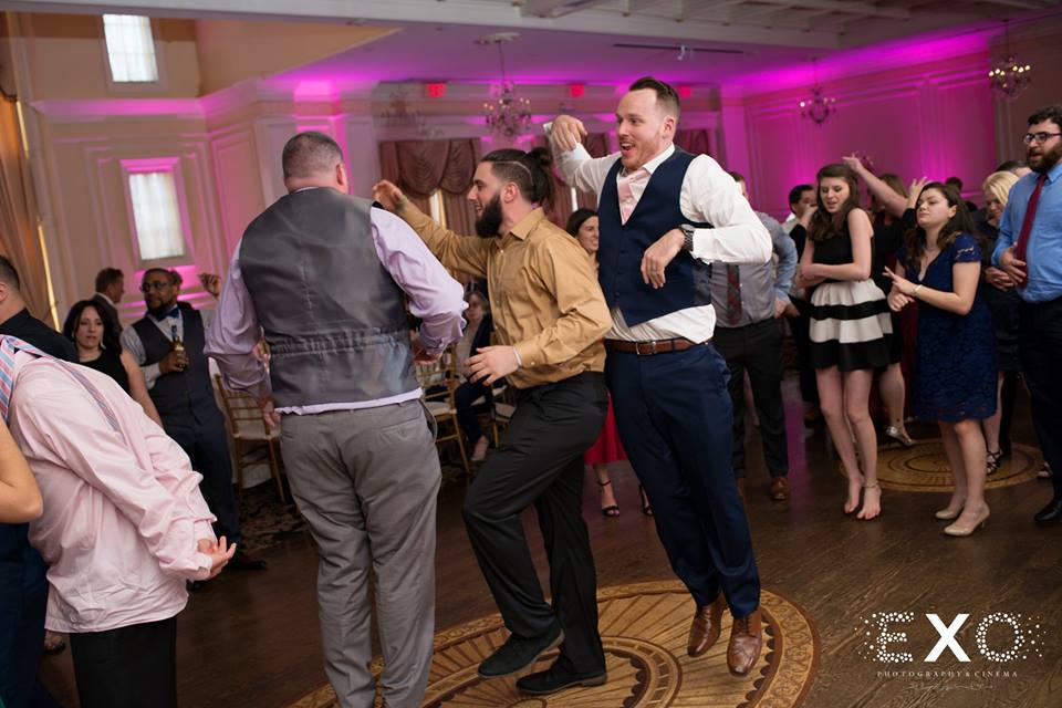 groom and guests dancing