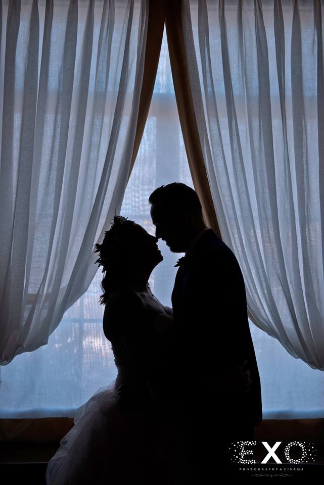 bride and groom in window