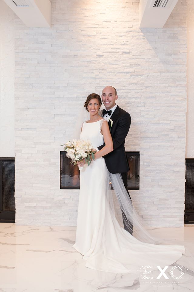 bride and groom posing at Temple Beth Torah