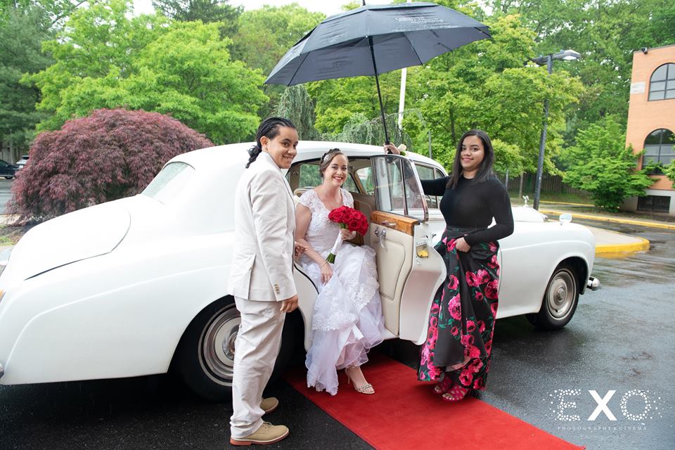 bride getting out of car for ceremony