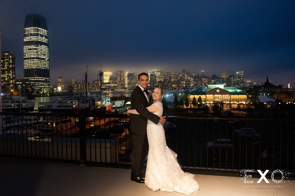 bride and groom on balcony outside Maritime Parc