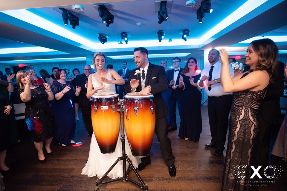 bride and groom playing drums at Harbor Club at Prime