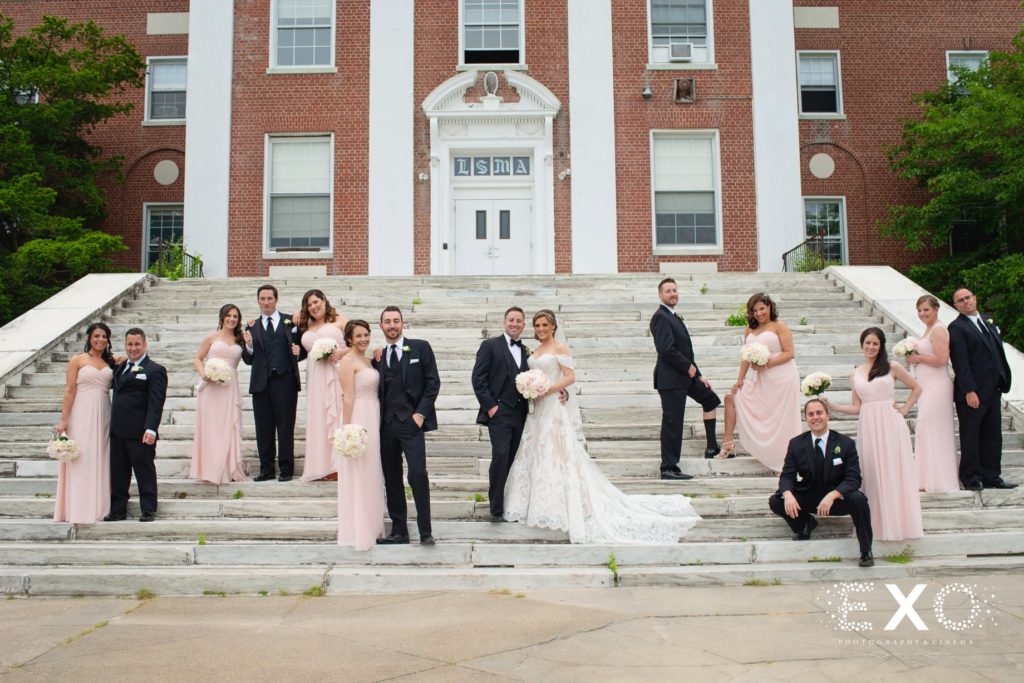 bridal party on steps outside Bourne Mansion