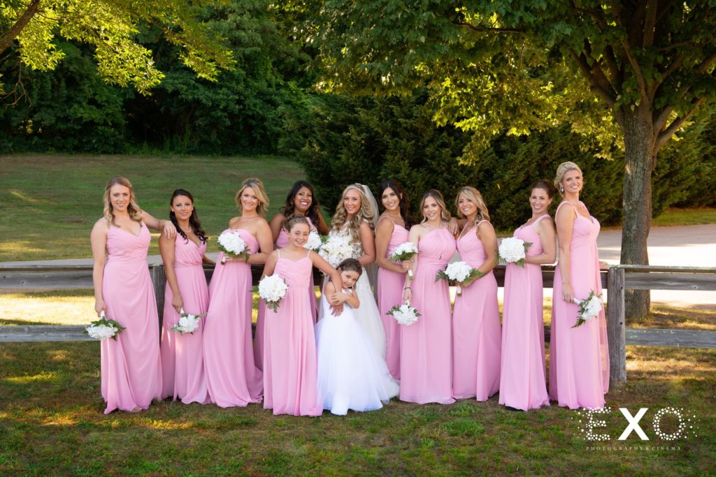bride and her bridesmaids outside Old Bethpage Village Restoration